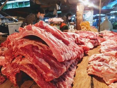 Giá thịt heo Trung Quốc tăng cao , heo hơi Việt Nam thấp hơn Trung Quốc 32.000 đồng/kg