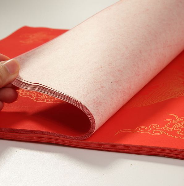 Giấy xuyến đỏ viết câu đối hình rồng phượng