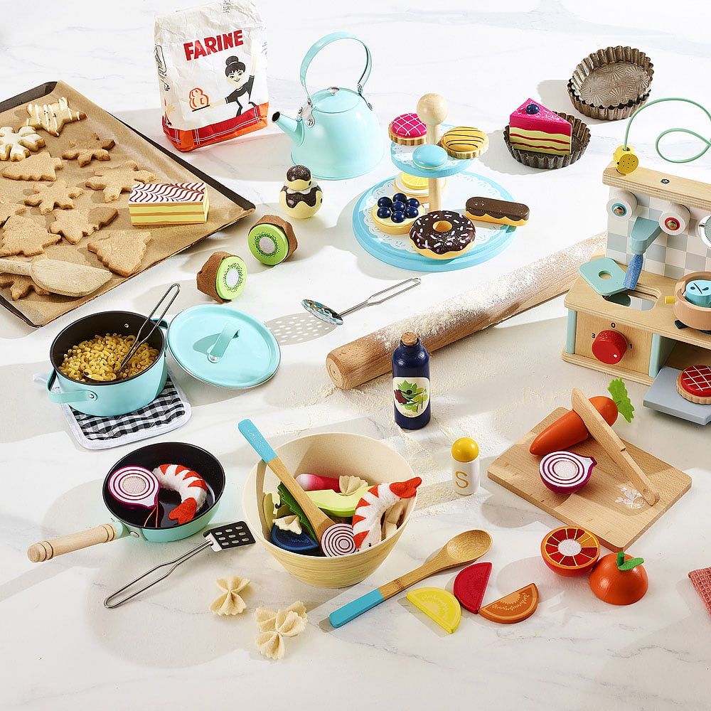 The benefits of pretend play toys for children, such as wooden fruits and toy kitchens.