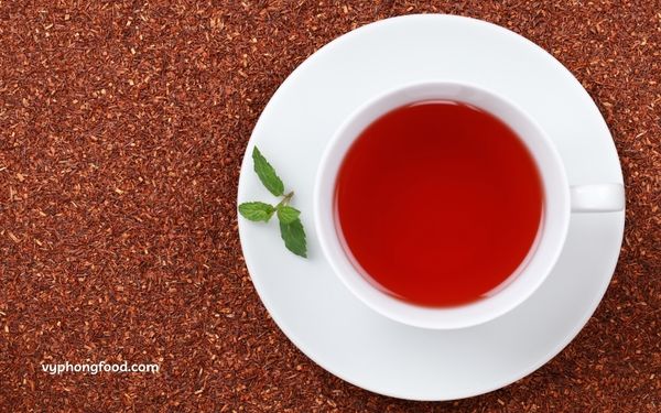 A cup of premium South African Rooibos tea served hot, showcasing its rich amber color and natural herbal aroma, known for its health-boosting antioxidants. Vyphongfood.com is the official importer of African Dawn Rooibos tea products.