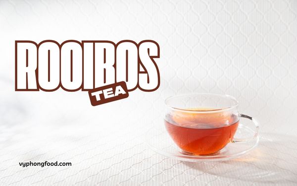 A cup of premium South African Rooibos tea served hot, showcasing its rich amber color and natural herbal aroma, known for its health-boosting antioxidants. Vyphongfood.com is the official importer of African Dawn Rooibos tea products.
