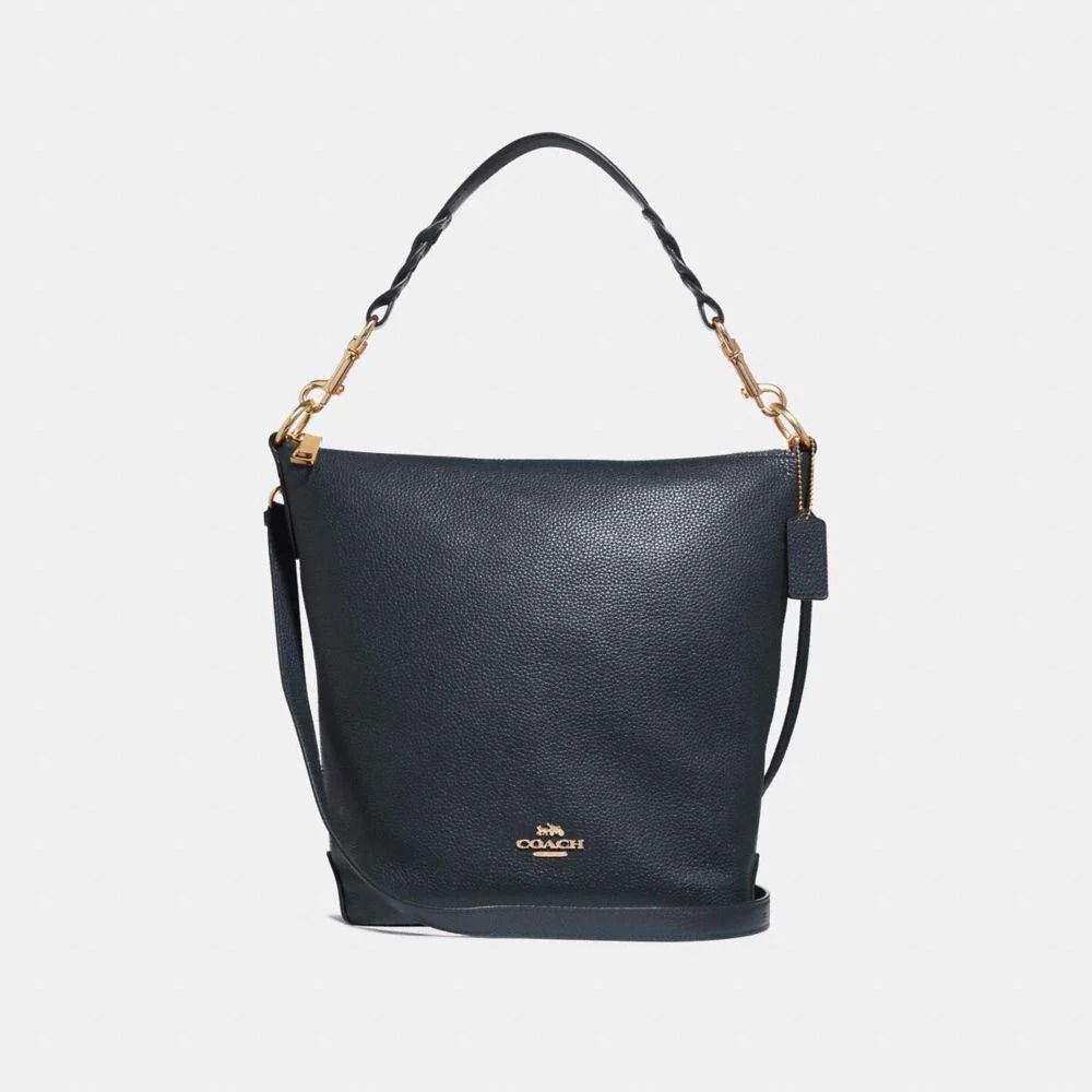 Bỏ túi bí quyết phối đồ với túi xách Coach