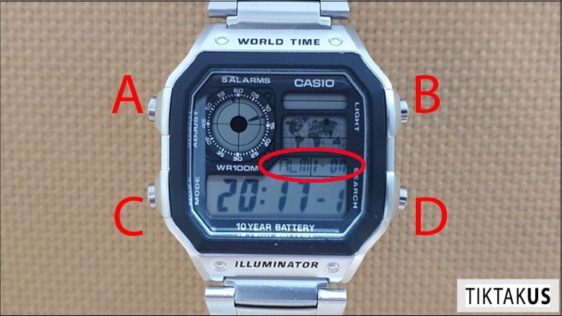 Nhấn nút C (Mode) để chuyển sang chế độ báo thức (thường là AL hoặc Alarm).