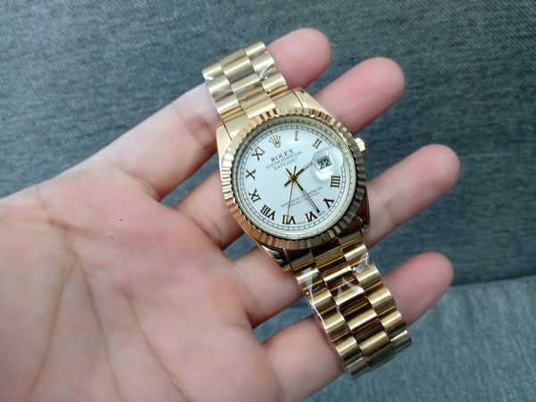 Đồng hồ Rolex mạ vàng, mặt trắng, cọc số La Mã, máy Nhật