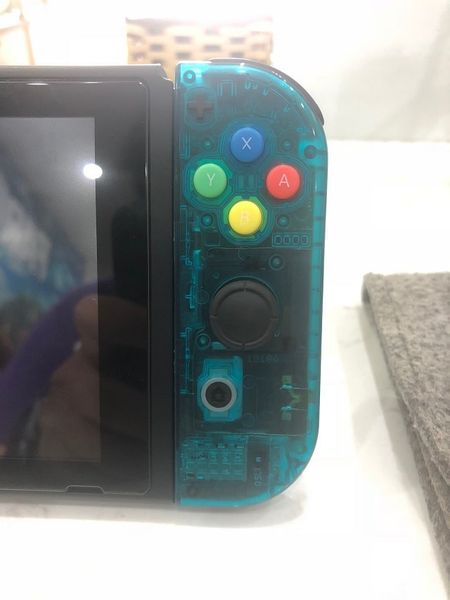 Nhìn thực tế Joycon phải trong suốt cho Nintendo Switch màu xanh ngọc