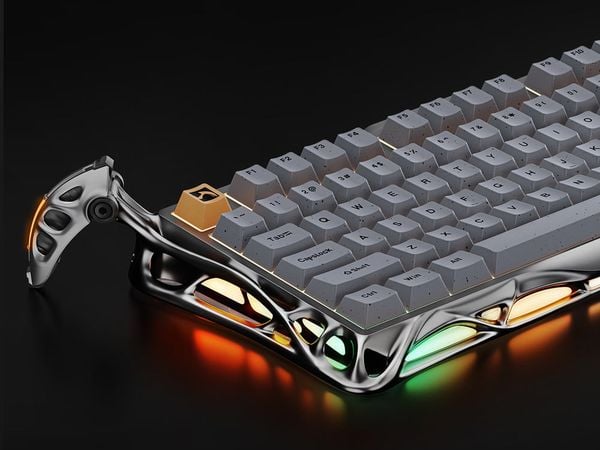 Bàn phím cơ GravaStar Mercury K1 Pro Concrete Gray nổi bật trên bàn làm việc, hiện đại với ánh sáng RGB