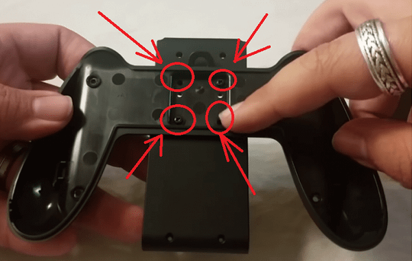 Unscrew the back of the joy-con grip