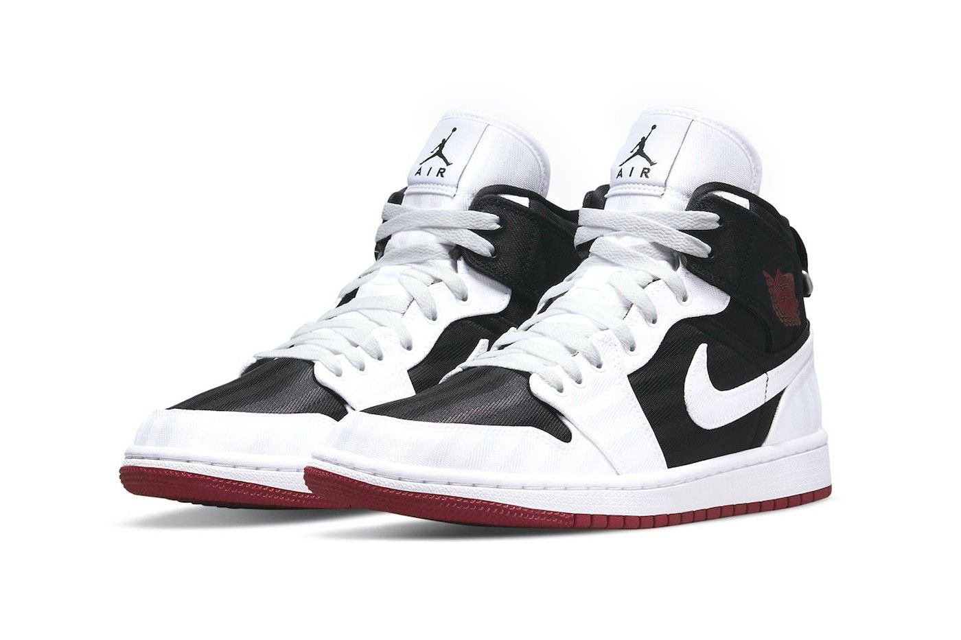 air-jordan-1-mid-se-trong-mot-tong-mau-trang-den-holy-toan-moi