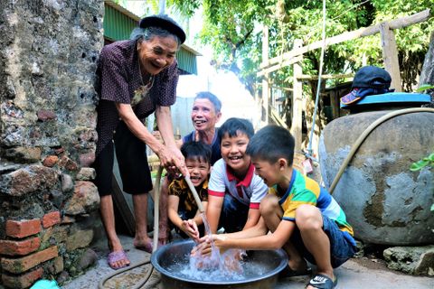 Villagers rejoice at having clean water.