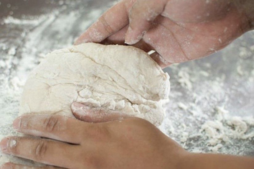 Kneading the dough is an extremely important step in making a firm pizza base