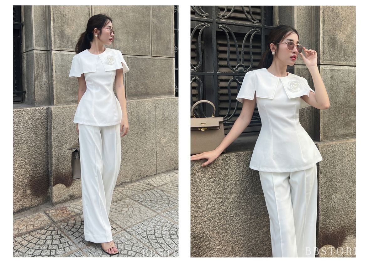 Người mẫu mặc Áo kiểu peplum cổ cape viền chỉ - A2186 màu trắng