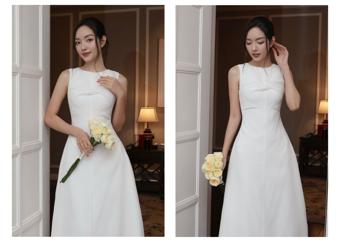 Người mẫu mặc Đầm dự tiệc dài xòe xoắn ngực - D4265B màu trắng