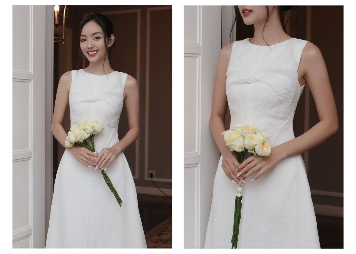 Người mẫu mặc Đầm dự tiệc dài xòe xoắn ngực - D4265B màu trắng