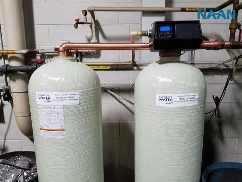 Why do industrial boilers need water softening treatment?