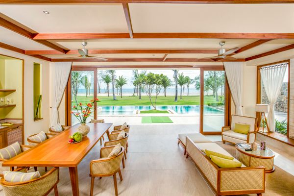 Living room space of villas with chairs and beach viiew at Fusion resort Phu Quoc
