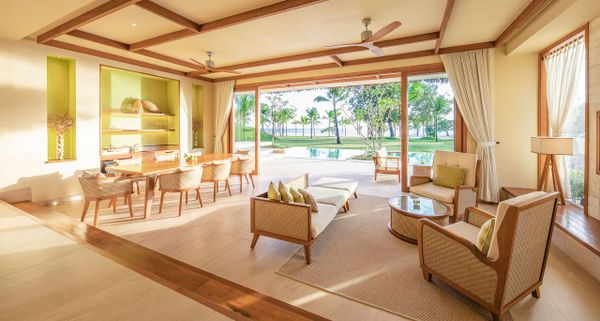 Living room space of villas with chairs and beach viiew at Fusion resort Phu Quoc