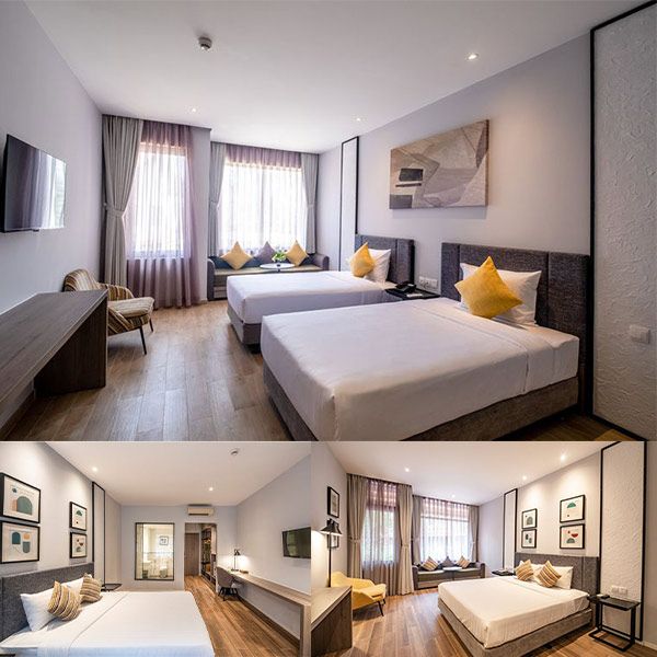 phòng resort có giường màu trắng và rèm cửa hướng vườn