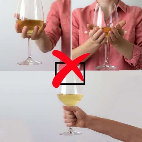 Không cầm bầu ly khi uống rượu vang