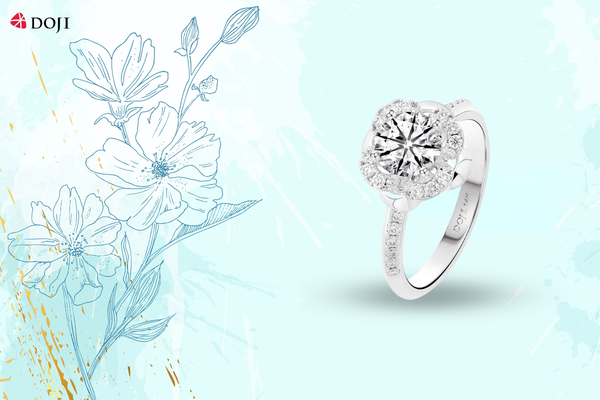 Thanh thoát như hoa nhài nở rộ, mẫu nhẫn vàng trắng 14K tỏa sáng tinh tế với thiết kế viền đá mềm mại và tâm điểm lấp lánh đầy cuốn hút