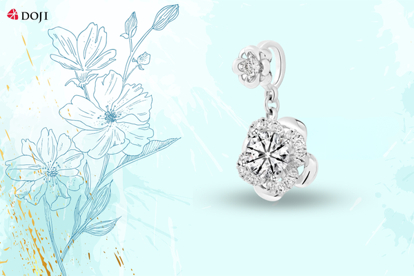 Thiết kế treo thanh thoát với điểm nhấn hai tầng hoa rực rỡ, mặt dây chuyền vàng trắng 14K mang lại nét cuốn hút dịu dàng trong từng chuyển động