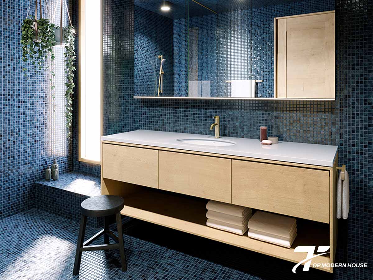 Bồn rửa mặt âm bàn nhỏ gọn, bố trí trong phòng tắm thoáng mát và gọn gàng.