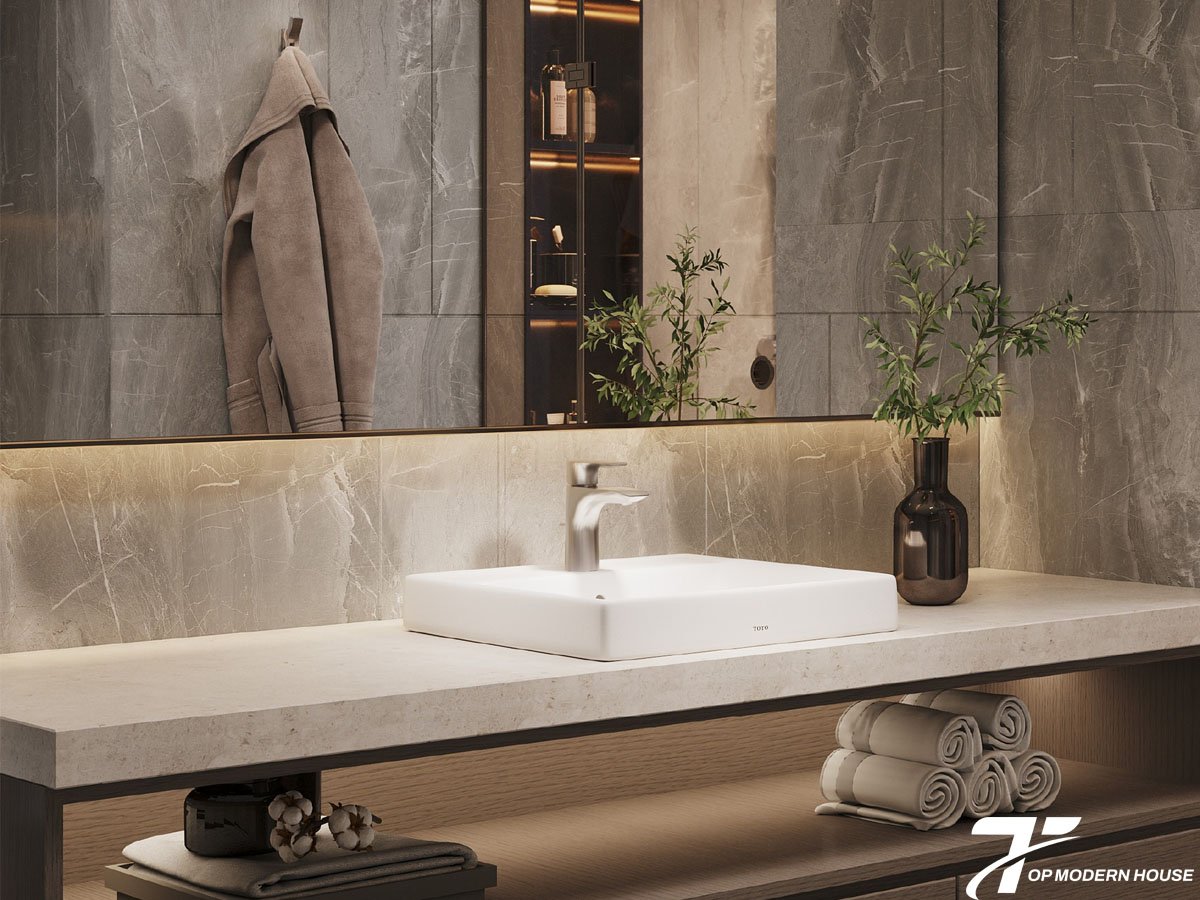 Vòi lavabo nóng lạnh TOTO gồm thân đồng thau, lõi van ceramic, tay gạt điều chỉnh và lớp mạ Nickel/Chrome bền đẹp.