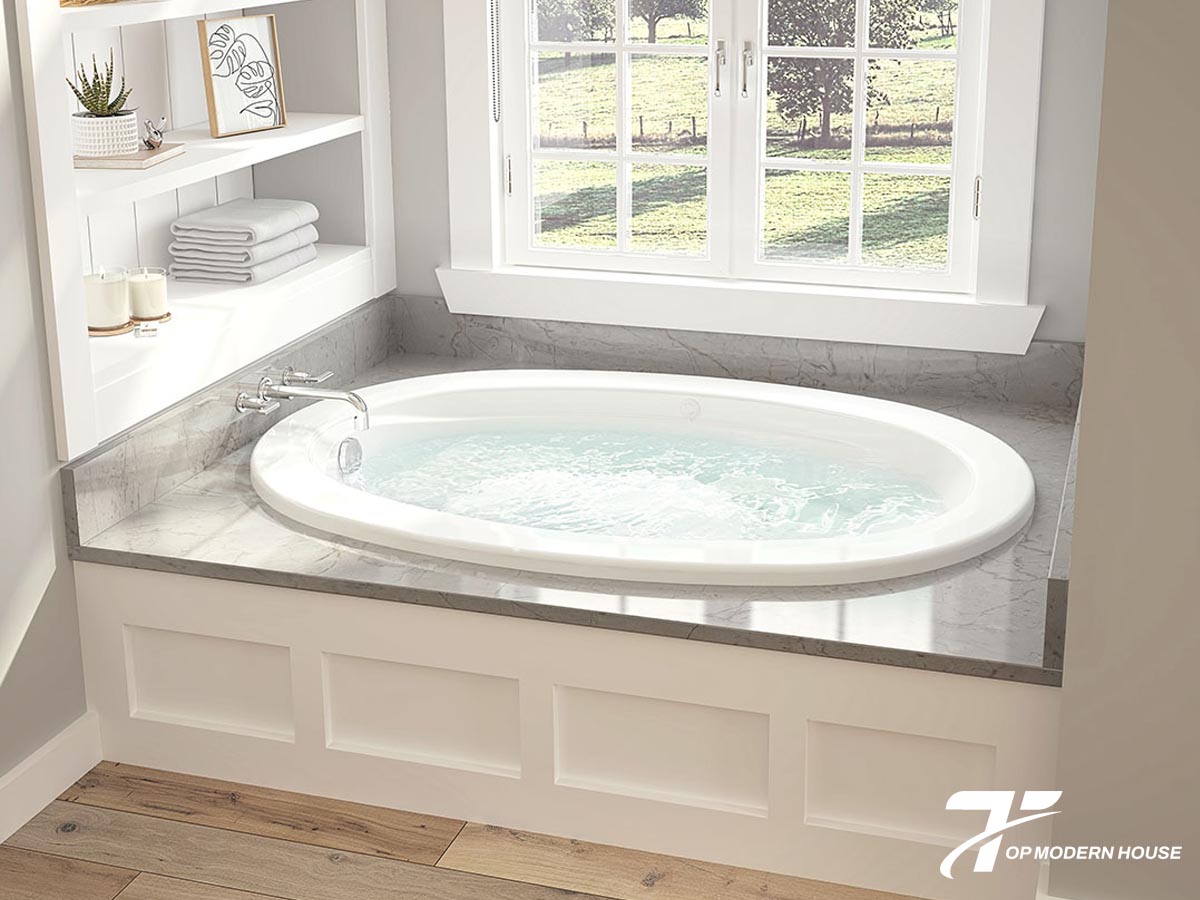 Bồn tắm sục có hệ thống vòi phun tạo bọt khí massage, thường đi kèm bảng điều khiển và máy bơm nước riêng.