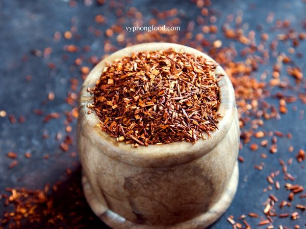 A steaming cup of premium South African Rooibos tea with its rich amber hue, showcasing the natural herbal aroma and antioxidant benefits of this caffeine-free beverage.