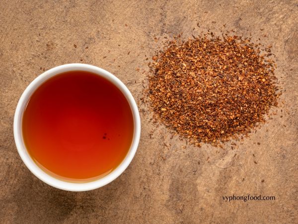 A steaming cup of premium South African Rooibos tea with its rich amber hue, showcasing the natural herbal aroma and antioxidant benefits of this caffeine-free beverage.